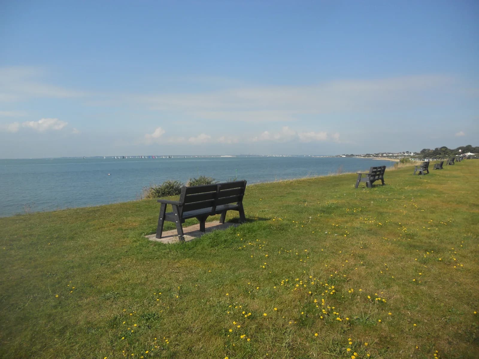 Benches on the grassy seafront at Lee-on-the-Solent overlooking the water